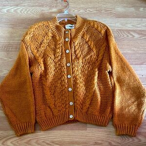 Cozy Orange Cable Knit Sweater
Knitted by hand
